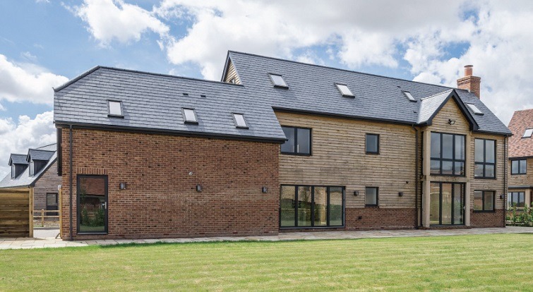 a house in the uk with a slate roof vents