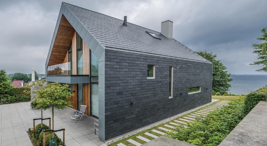 Impressive slate-clad home with large windows