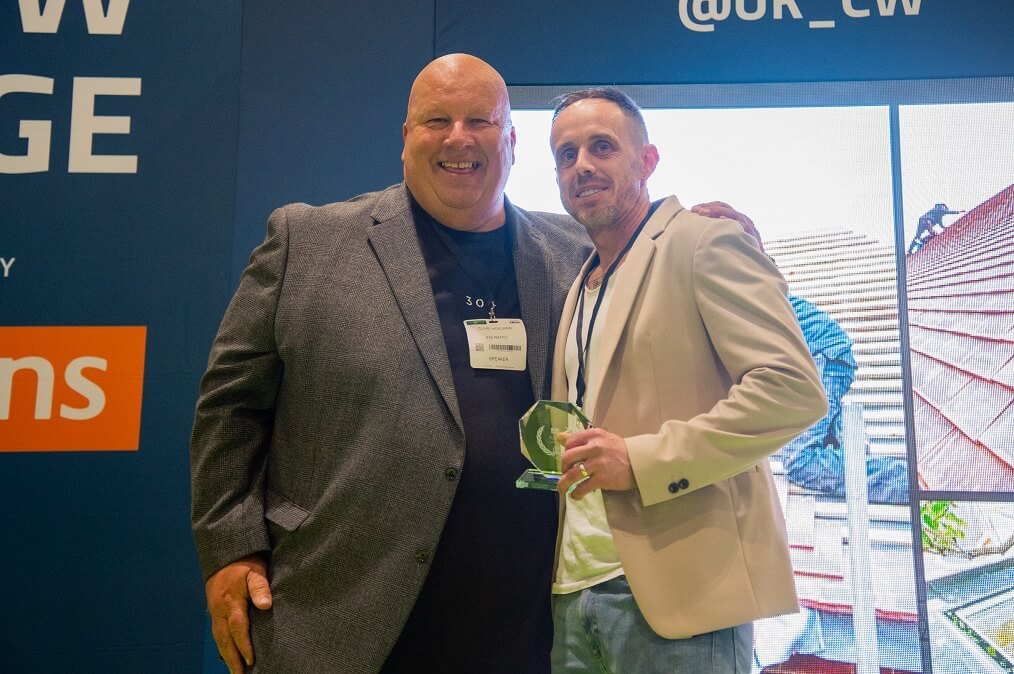 Clive Holland from Fix Radio with Danny Madden roofer of the year award