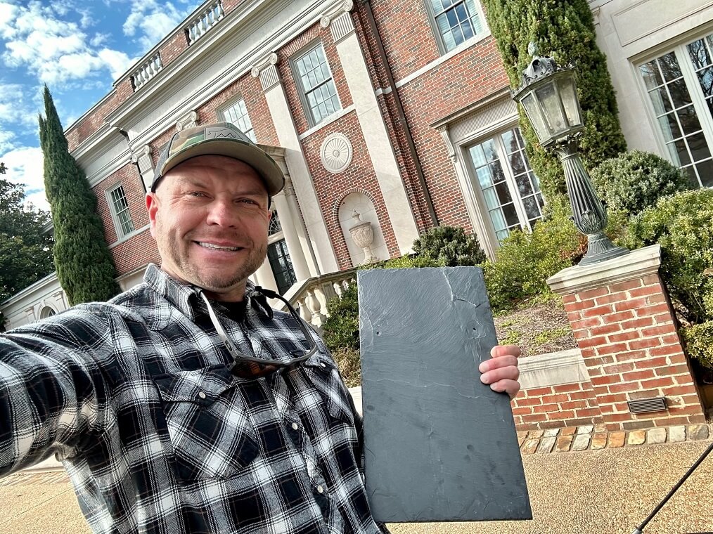 abm roofing Andy Matyszewski with a piece of slate